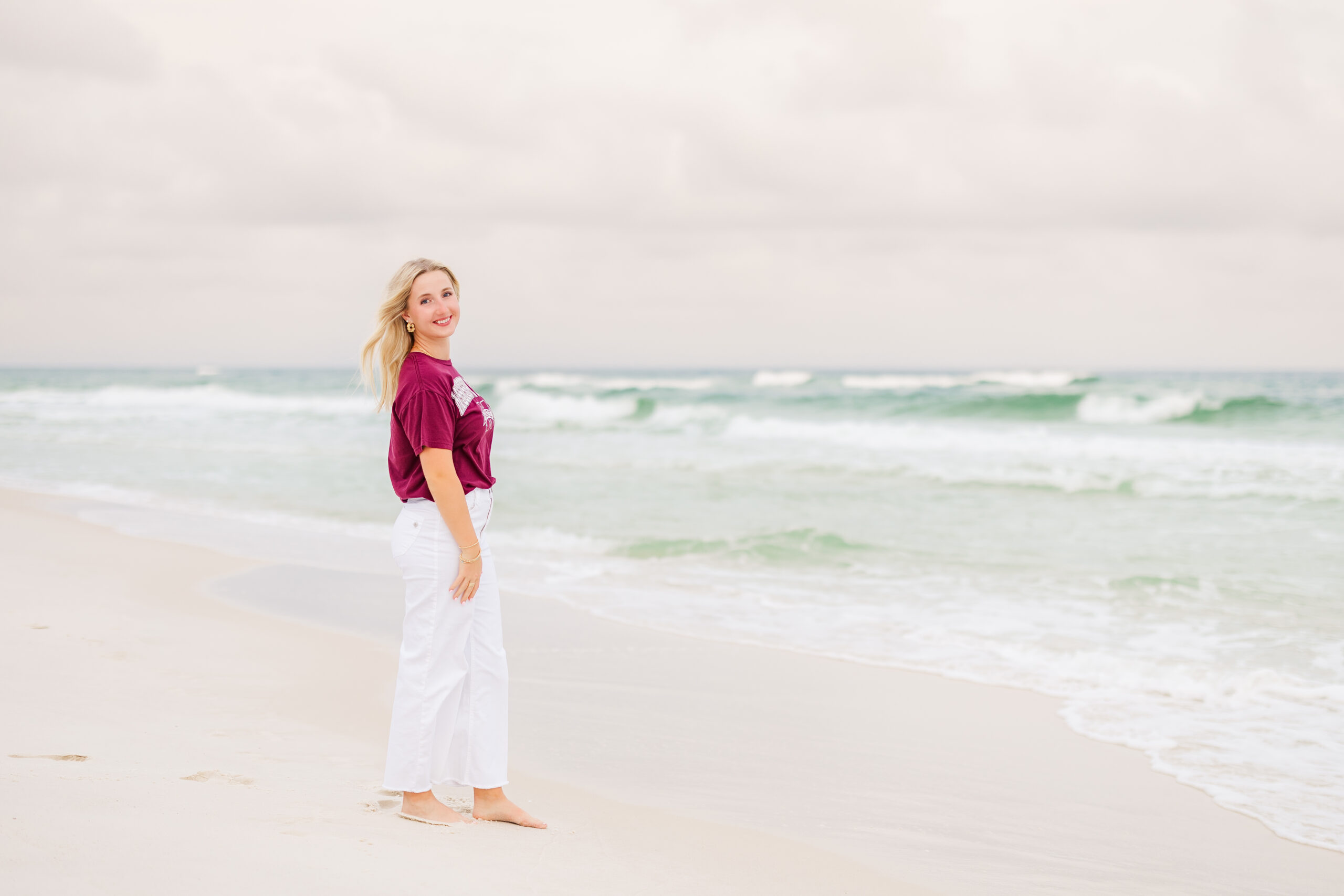 senior photos on pensacola beach at sunset