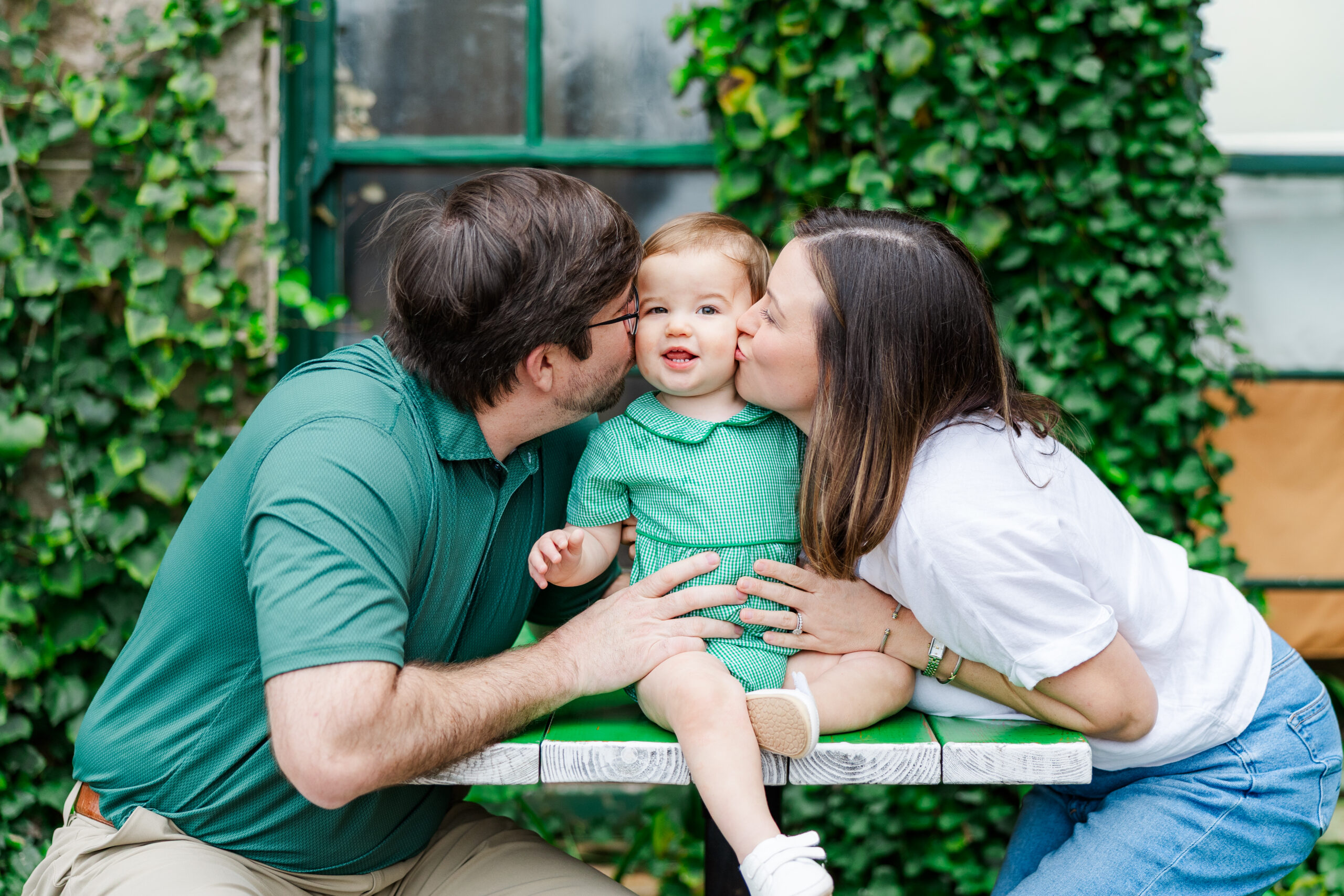 one year session at the new studio
mom and dad kissing their baby boy