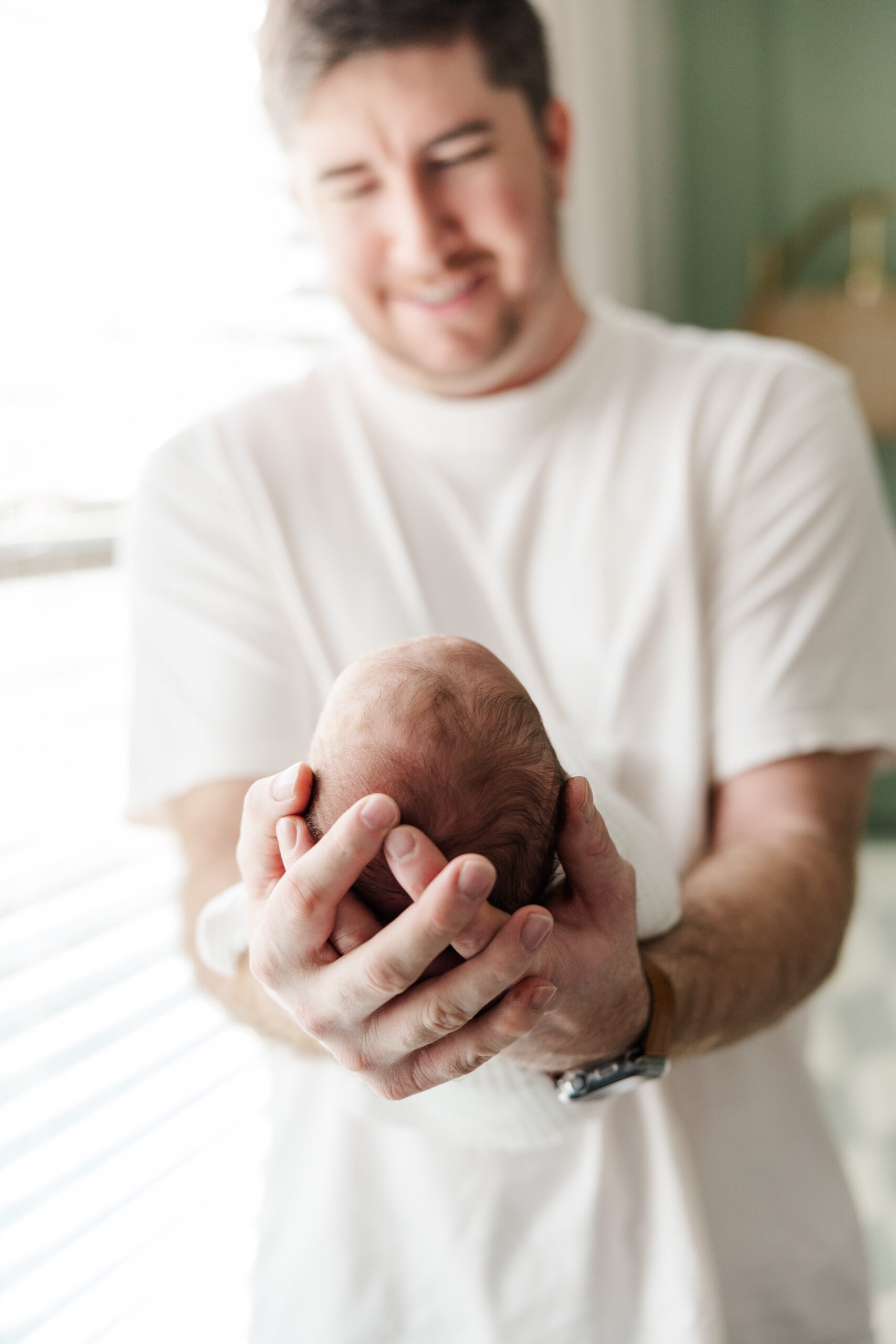 dad holding baby