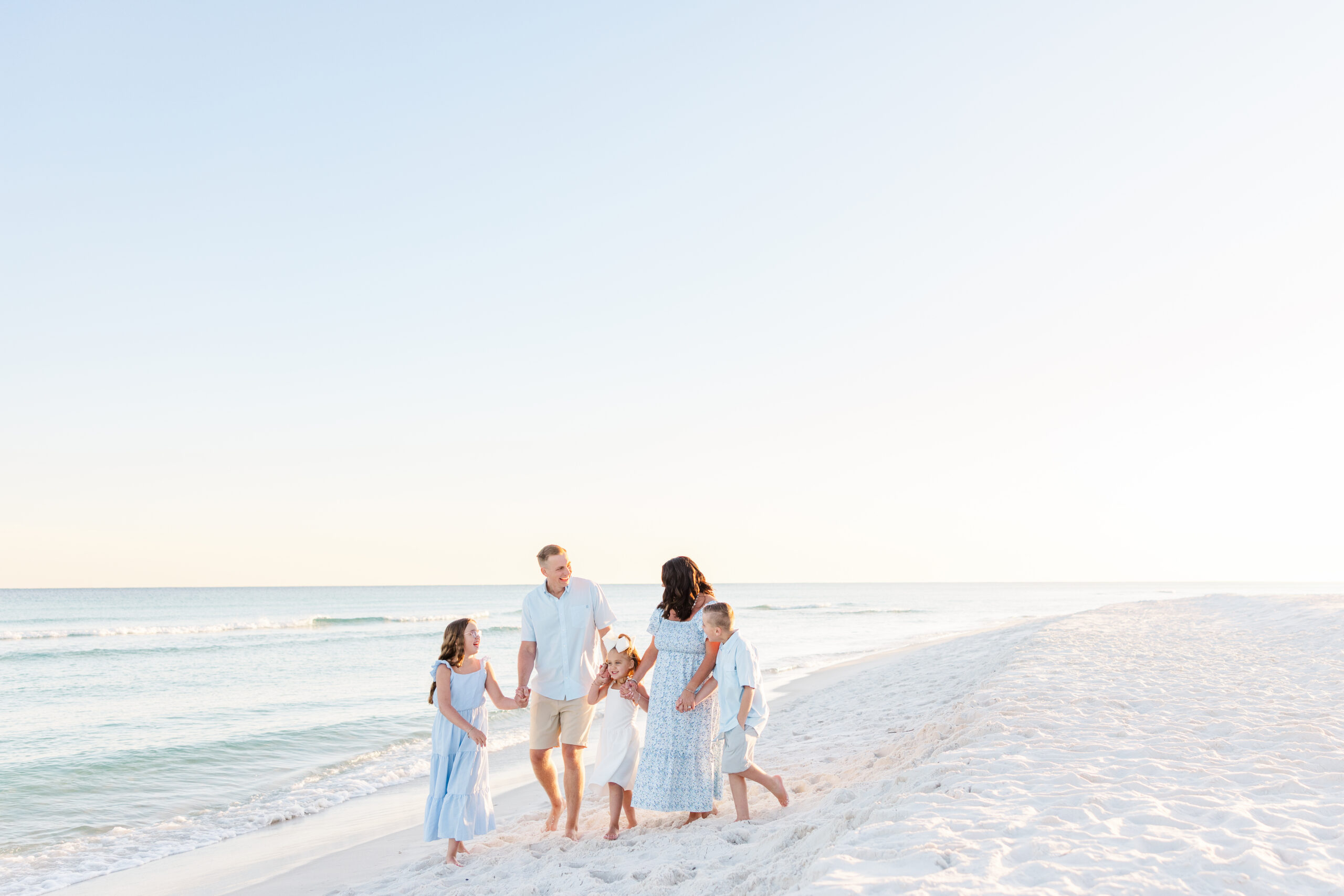 family walking on Pensacola Beach