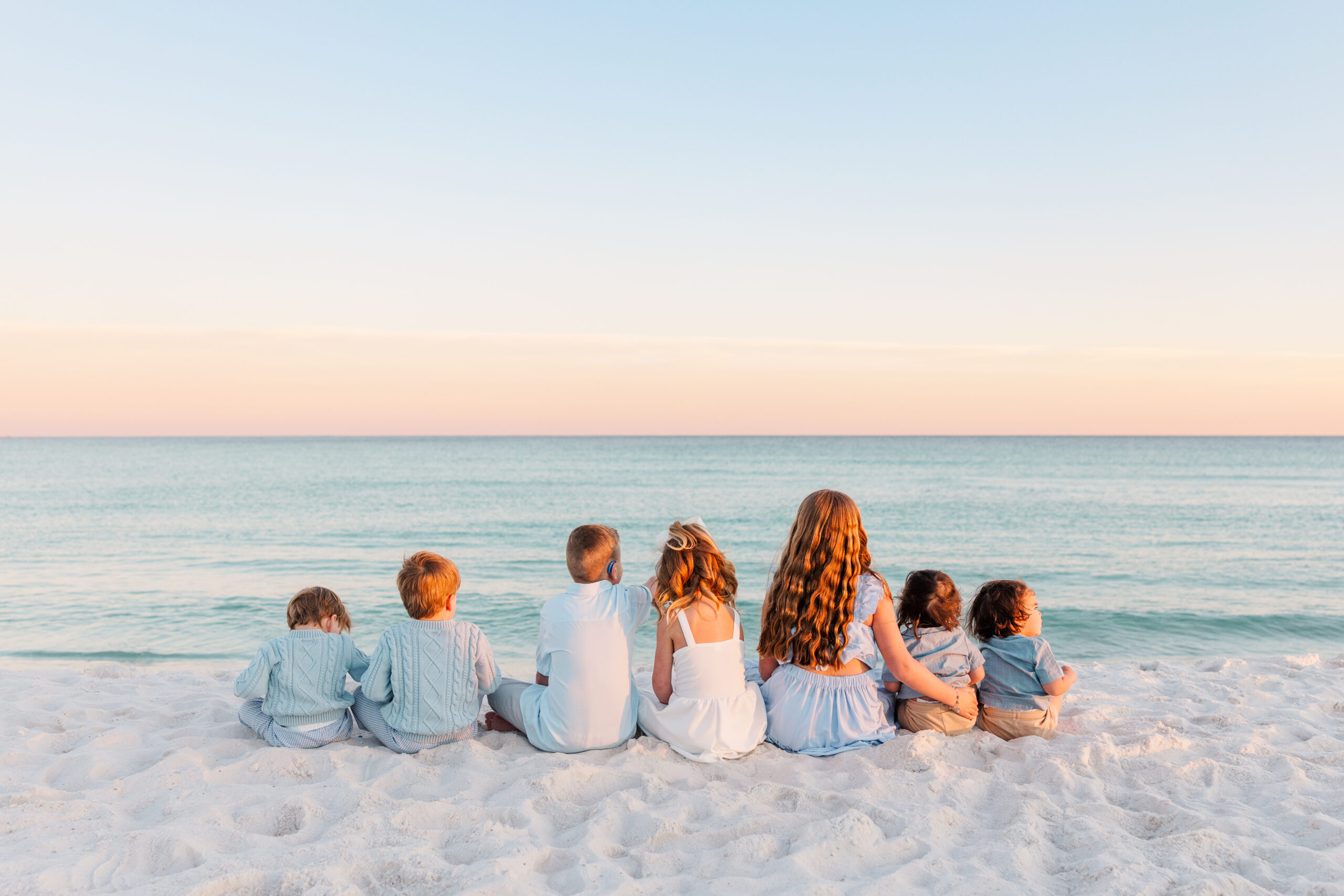 all the grandchildren staring at the gulf on Pensacola Beach