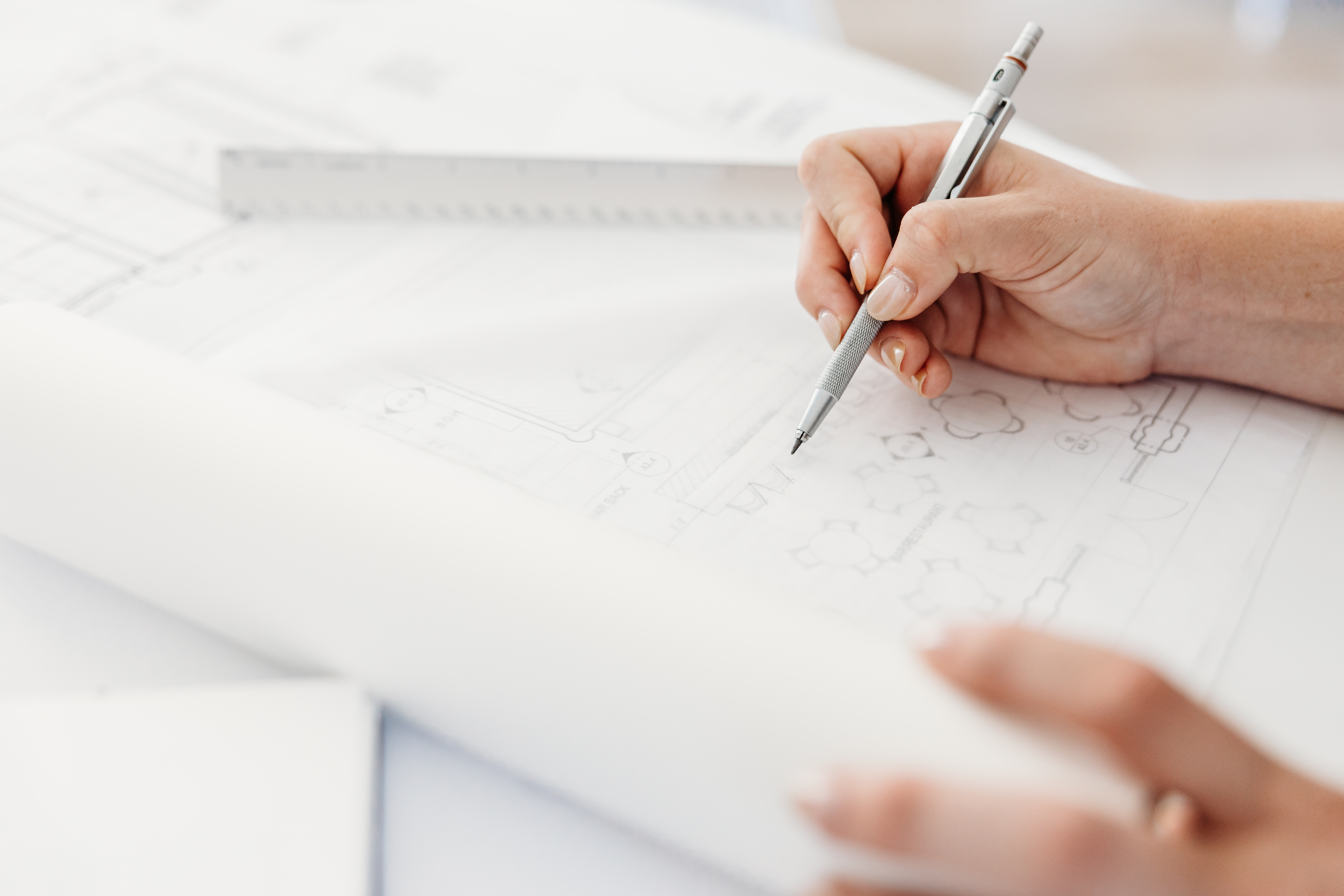 Architect writing with pencil